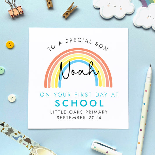 A personalised first day at school card for boy, featuring a rainbow. It can be personalised with a child's name, school and date. It is also suitable for 1st day at nursery, primary school and secondary school. The relation can be changed to son, grandson, nephew, brother, cousin or boy.