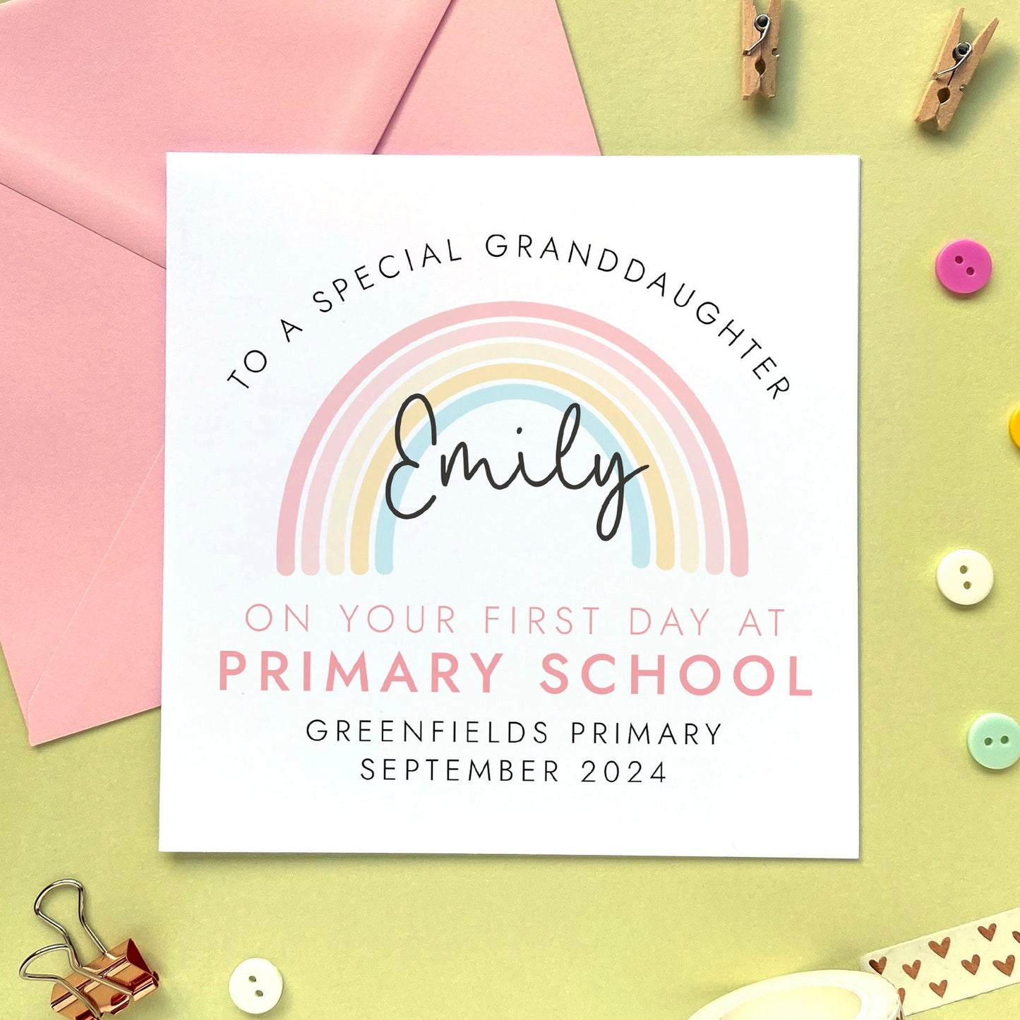 A personalised first day at primary school card for girl, featuring a pink rainbow. It can be personalised with a child's name, school and date. It is also suitable for 1st day at primary school, secondary school, nursery and infant school. The relation can be changed to daughter, granddaughter, niece, cousin, sister or goddaughter.