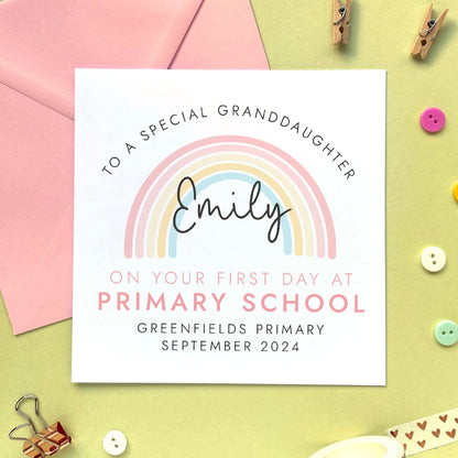 A personalised first day at primary school card for girl, featuring a pink rainbow. It can be personalised with a child's name, school and date. It is also suitable for 1st day at primary school, secondary school, nursery and infant school. The relation can be changed to daughter, granddaughter, niece, cousin, sister or goddaughter.