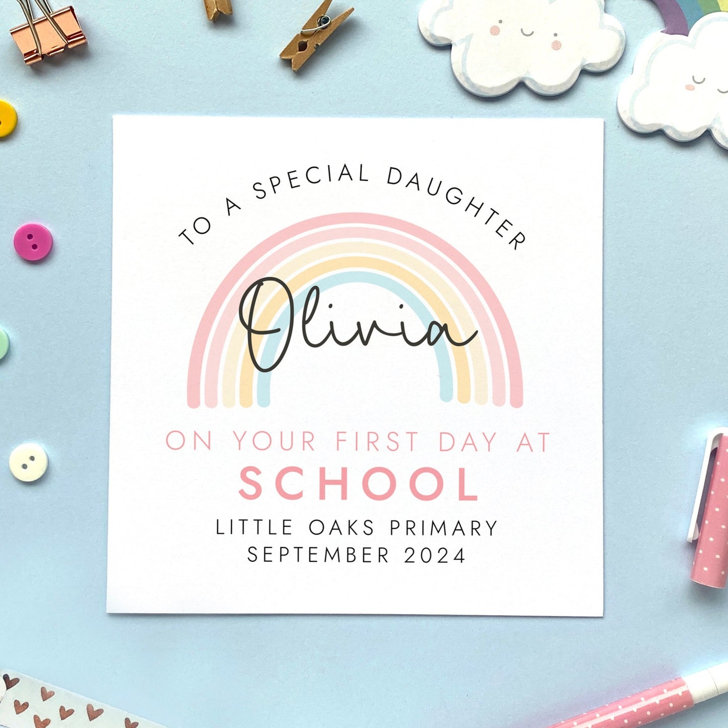 A personalised first day at school card for girl, featuring a pink rainbow. It can be personalised with a child's name, school and date. It is also suitable for 1st day at primary school, secondary school, nursery and infant school. The relation can be changed to daughter, granddaughter, niece, cousin, sister or goddaughter.