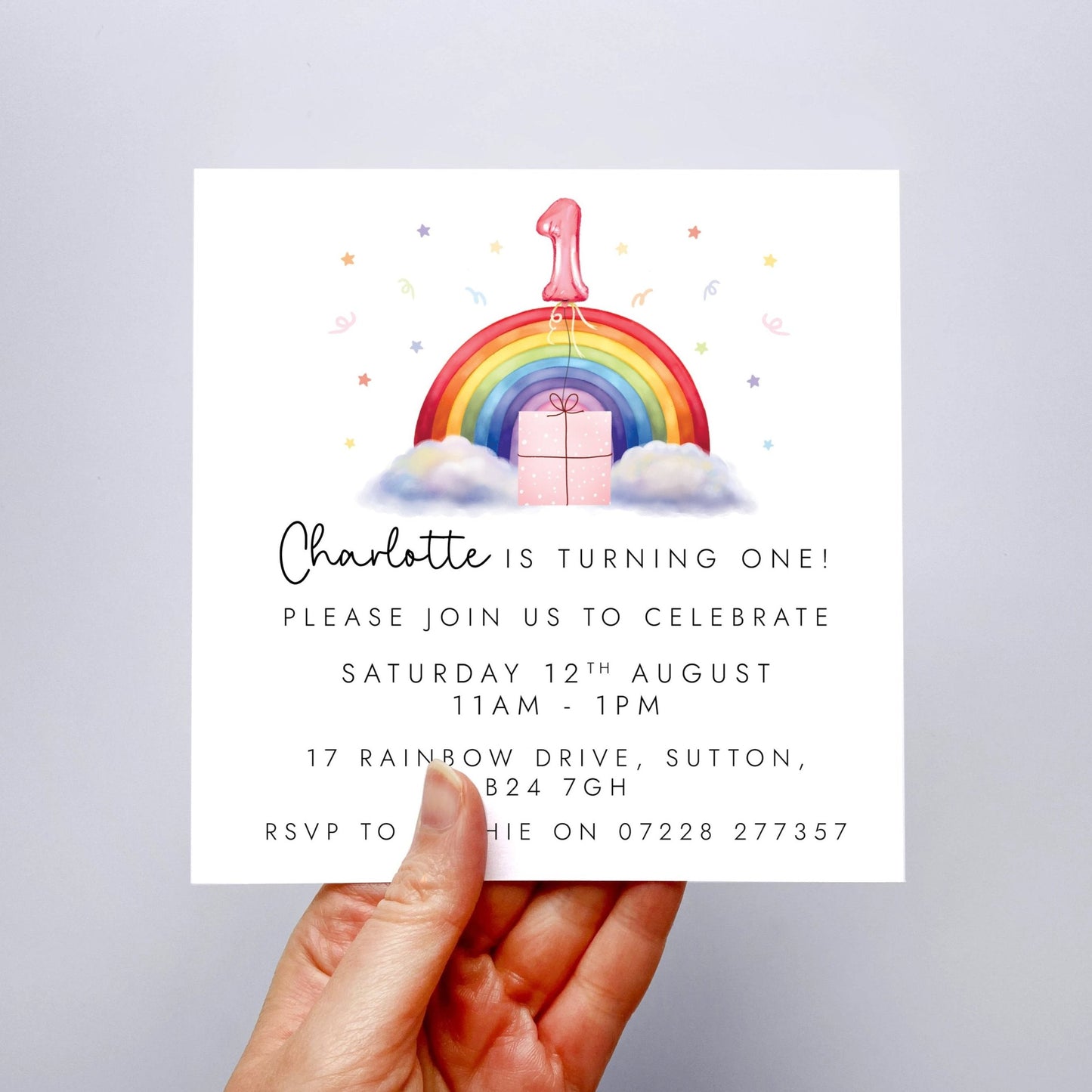 Personalised rainbow themed party invitations for a little girl's birthday party. The photo shows invites for a child's 1st birthday party.