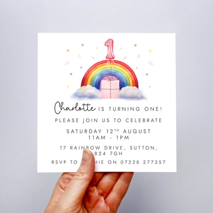 Personalised rainbow themed party invitations for a little girl's birthday party. The photo shows invites for a child's 1st birthday party.