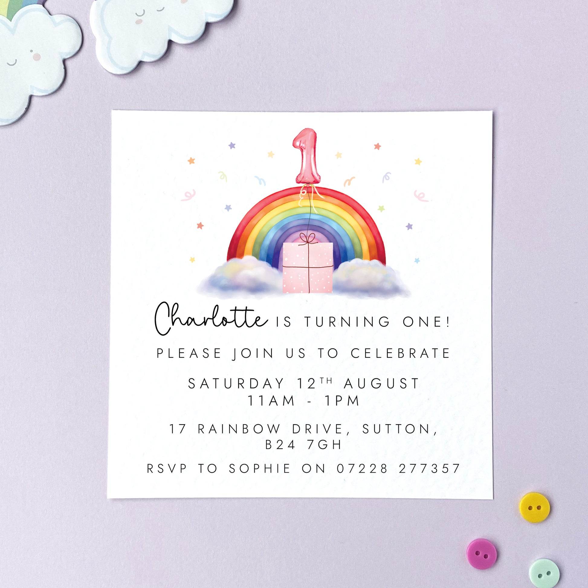 Personalised rainbow themed party invitations for a little girl's birthday party. The photo shows invites for a child's 1st birthday party.