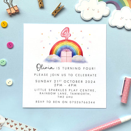 Personalised rainbow themed party invitations for a little girl's birthday party. The photo shows invites for a child's 4th birthday party.