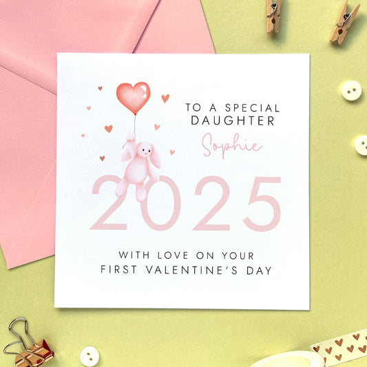 A personalised first valentine's day card for baby's 1st valentines. Including a pink theme and a baby toy bunny, it can be personalised with any girl's name. The card in the photo is for Daughter, it can be changed to be made suitable for Granddaughter, Great Granddaughter and Niece.