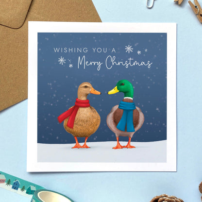 A Christmas Card with two mallard ducks, one male and one female. The text on the card reads 'Wishing you a Merry Christmas'.