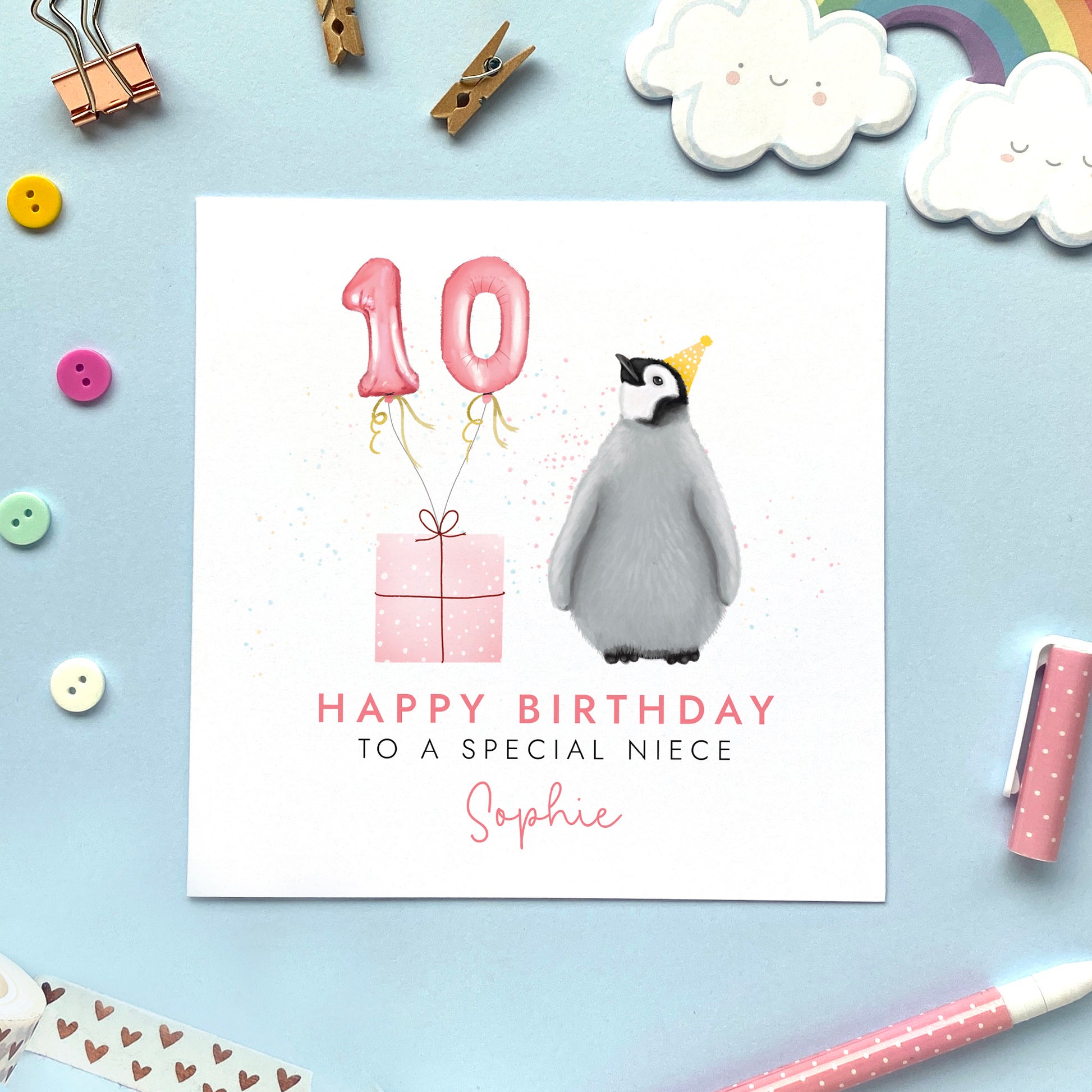 A cute personalised birthday card featuring a baby penguin and pink balloons. It can be personalised with any name, for any female relation such as Daughter, Granddaughter, Niece and Sister. The age can be changed to any, such as 1st, 2nd, 3rd, 4th, 5th, 10th, 13th and 18th. The card in the photo is a 10th birthday card for Niece.