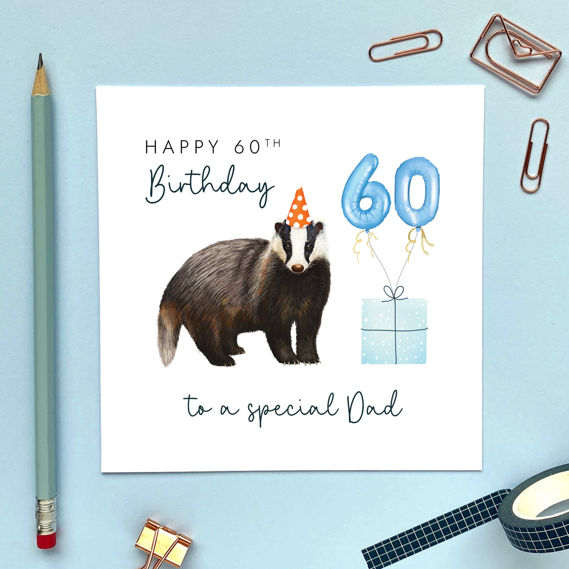 A personalised birthday card for him featuring a british badger. The card in the photo is for a 60th birthday card for Dad.