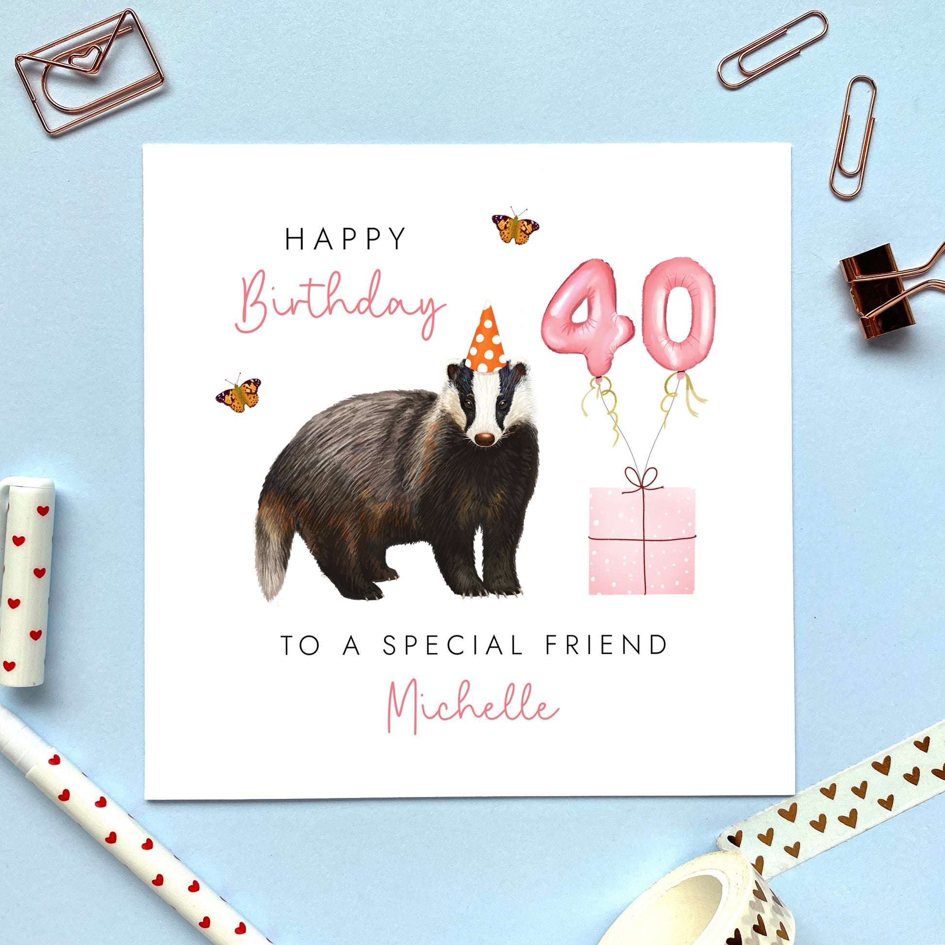 A personalised birthday card for her featuring a british badger. The card in the photo is a 40th birthday card for friend.