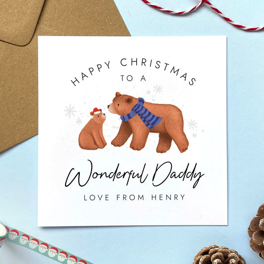 A personalised bears Christmas card for Daddy. It features a cute illustration of a brown bear and baby bear. It can be personalised with any child's name, and makes an ideal Christmas card for Dad from Son or Daughter.