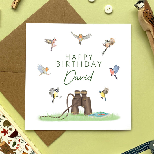 A personalised birthday card for him featuring a variety of different british garden birds and a pair of classic binoculars. It would be ideal for any male relation who's into birdwatching or wildlife. It's suitable for Dad, Grandad, Uncle, Grandpa, Husband, Friend and older men. The age can be changed to any, including 50th, 60th, 70th, 80th and 90th.