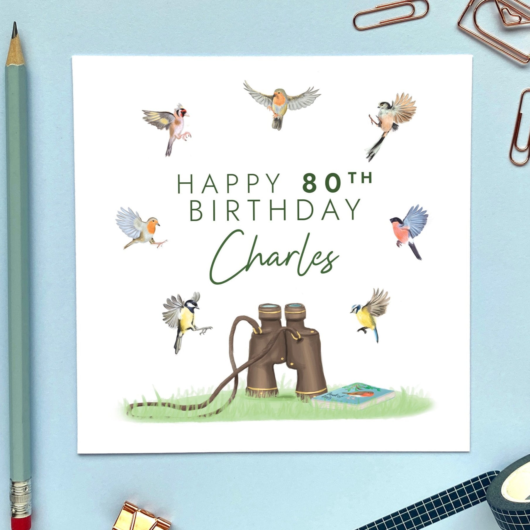 A personalised birthday card for him featuring a variety of different british garden birds and a pair of classic binoculars. It would be ideal for any male relation who's into birdwatching or wildlife. It's suitable for Dad, Grandad, Uncle, Grandpa, Husband, Friend and older men. The age can be changed to any, including 50th, 60th, 70th, 80th and 90th. The card in the photo is for 80th birthday.