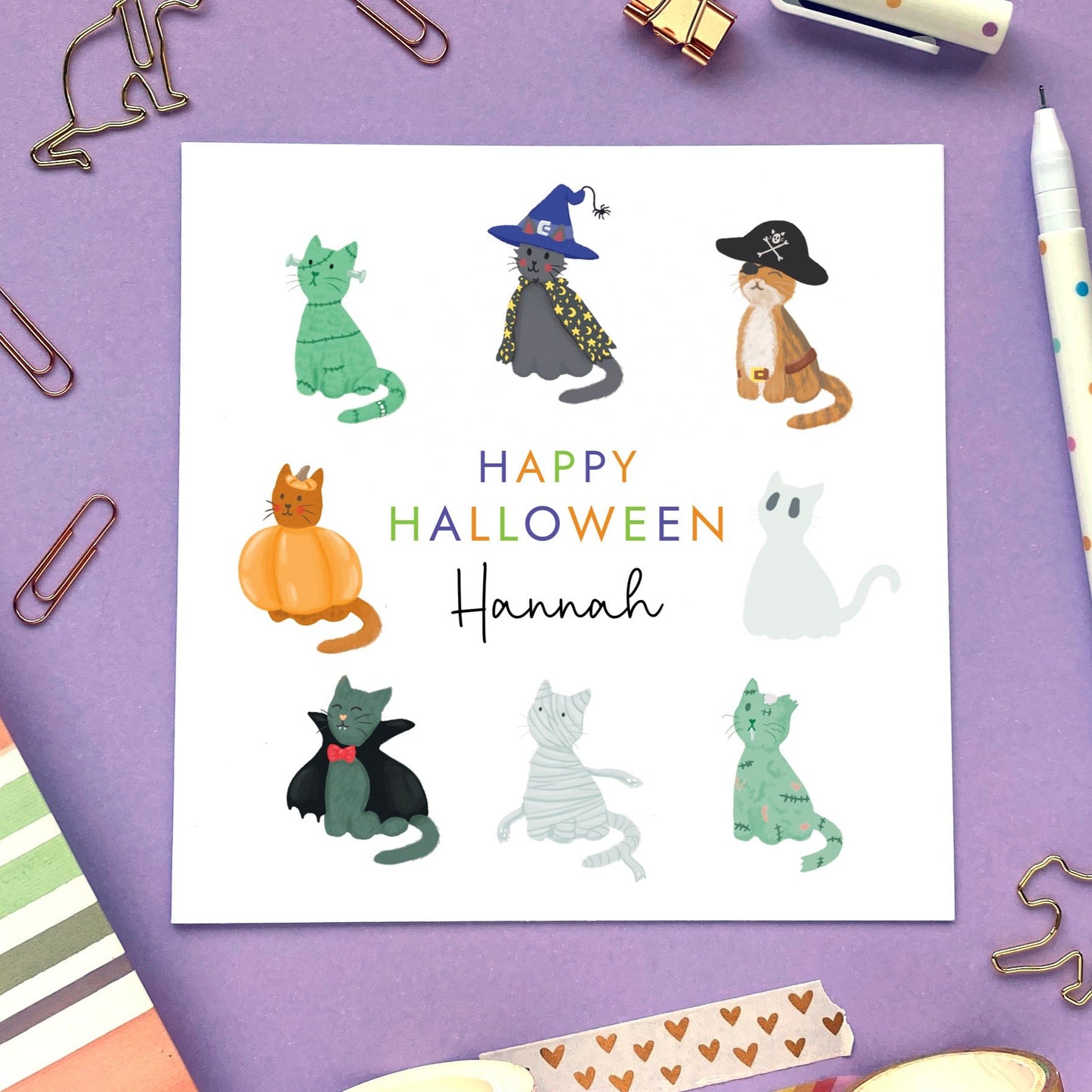 A personalised cat themed Halloween card. It features 8 different cute cat designs in spooky themed outfits.