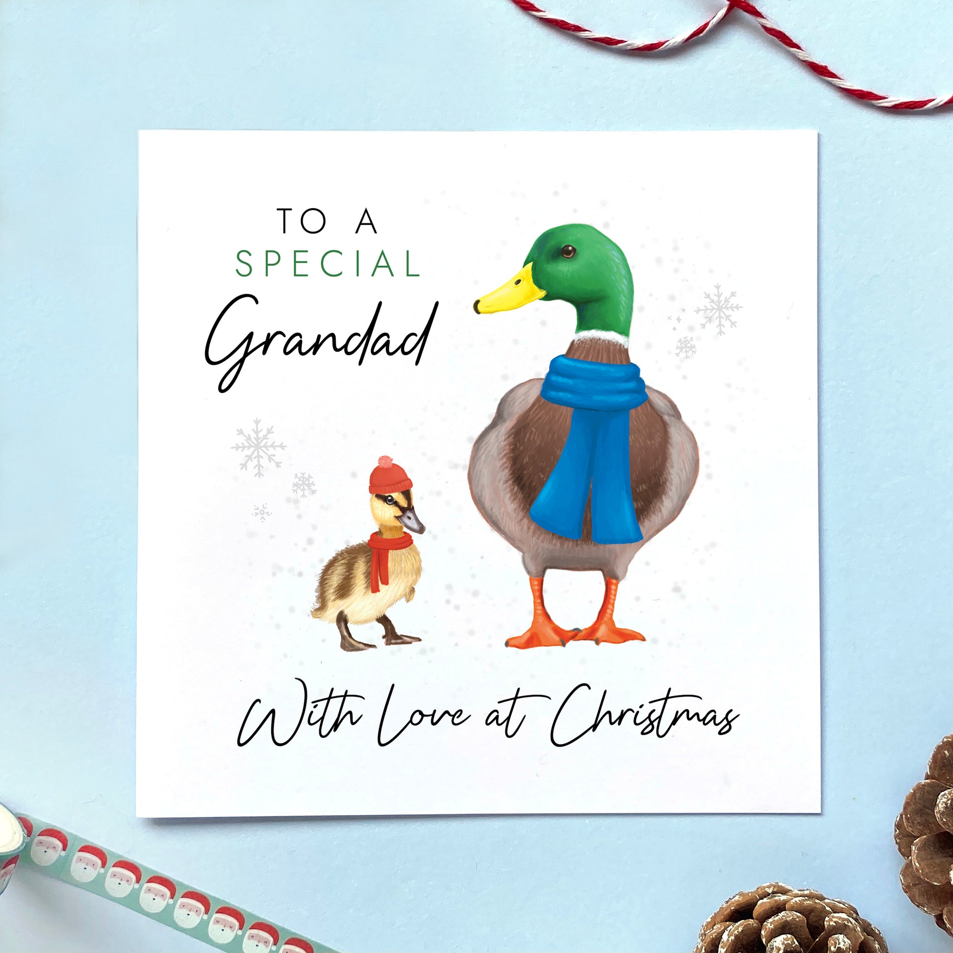 A personalised ducks christmas card for Grandad. It features a male mallard duck next to a baby duckling, with the text 'To a special Grandad, with love at Christmas'.