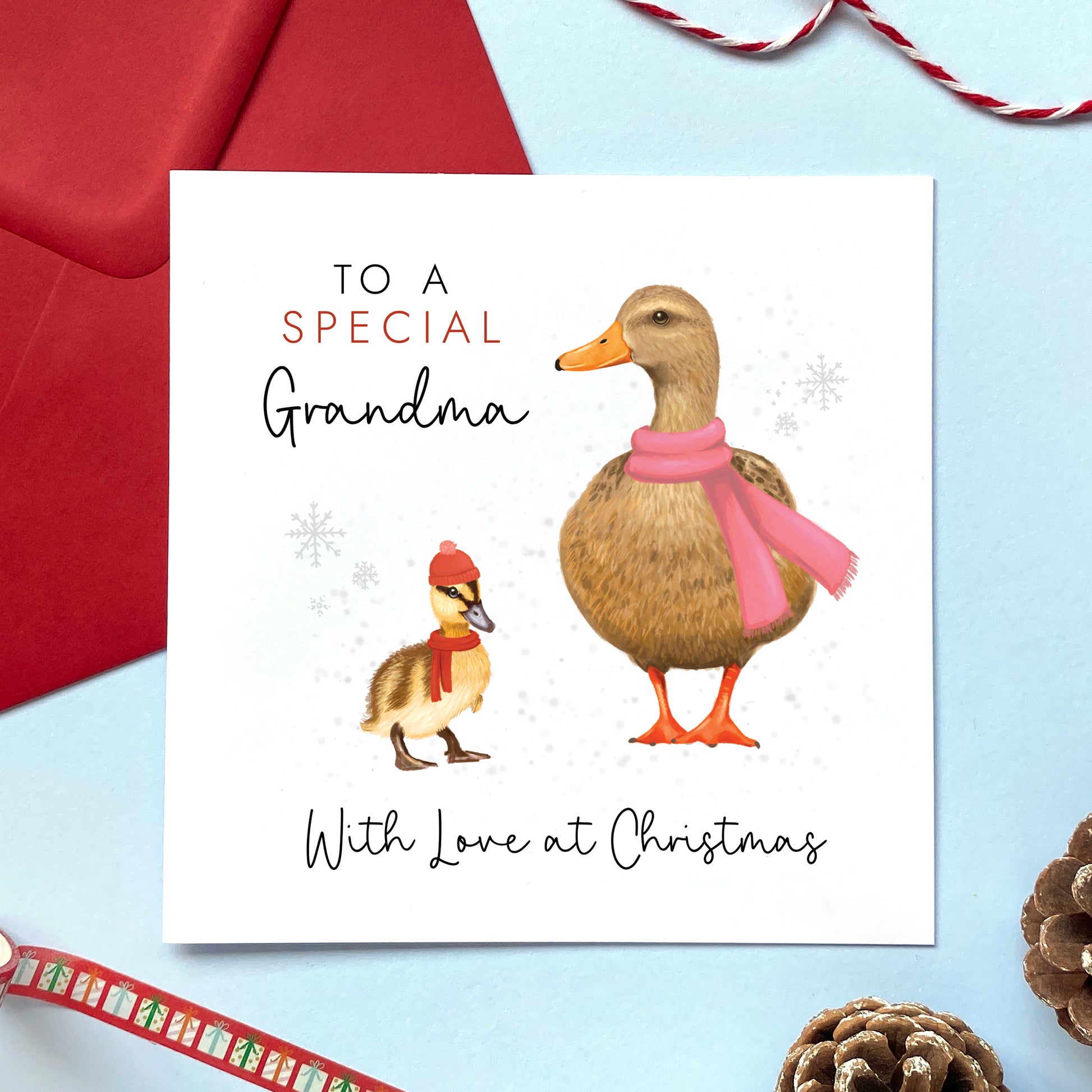 A personalised duck Christmas card for Grandmother. It features a female mallard duck next a baby duckling. The card in the photo is a Christmas card for a special Grandma.