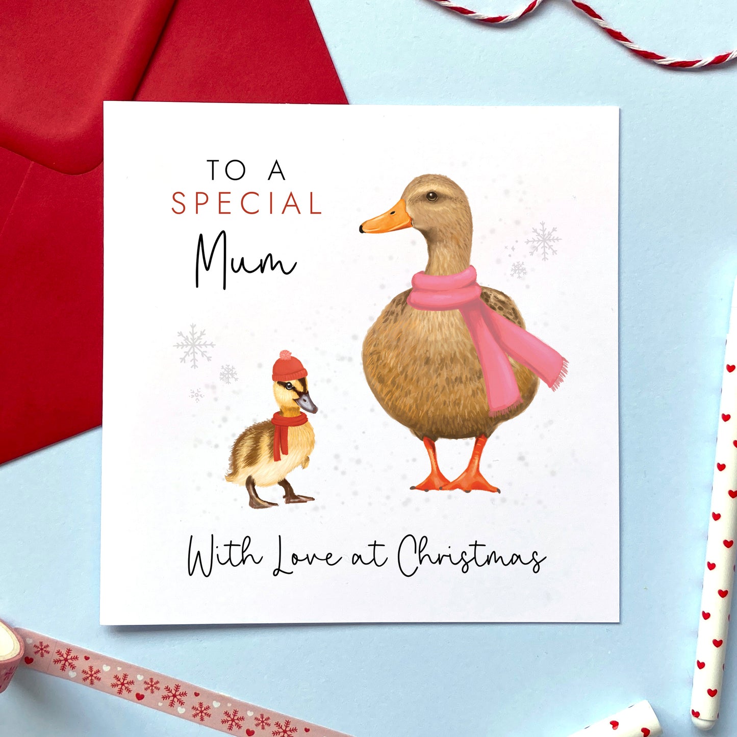 A personalised ducks christmas card for Mum. It features a female mallard duck next to a baby duckling with the text 'To a special Mum, with love at Christmas'.