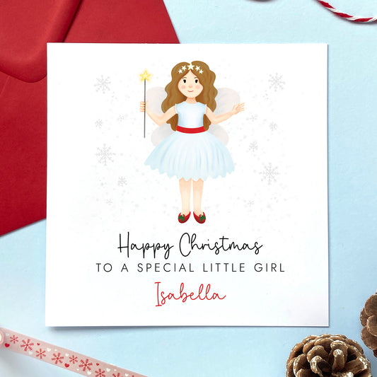 A personalised Christmas card for Little Girl featuring a festive themed fairy with brown hair. It can be personalised with a name.