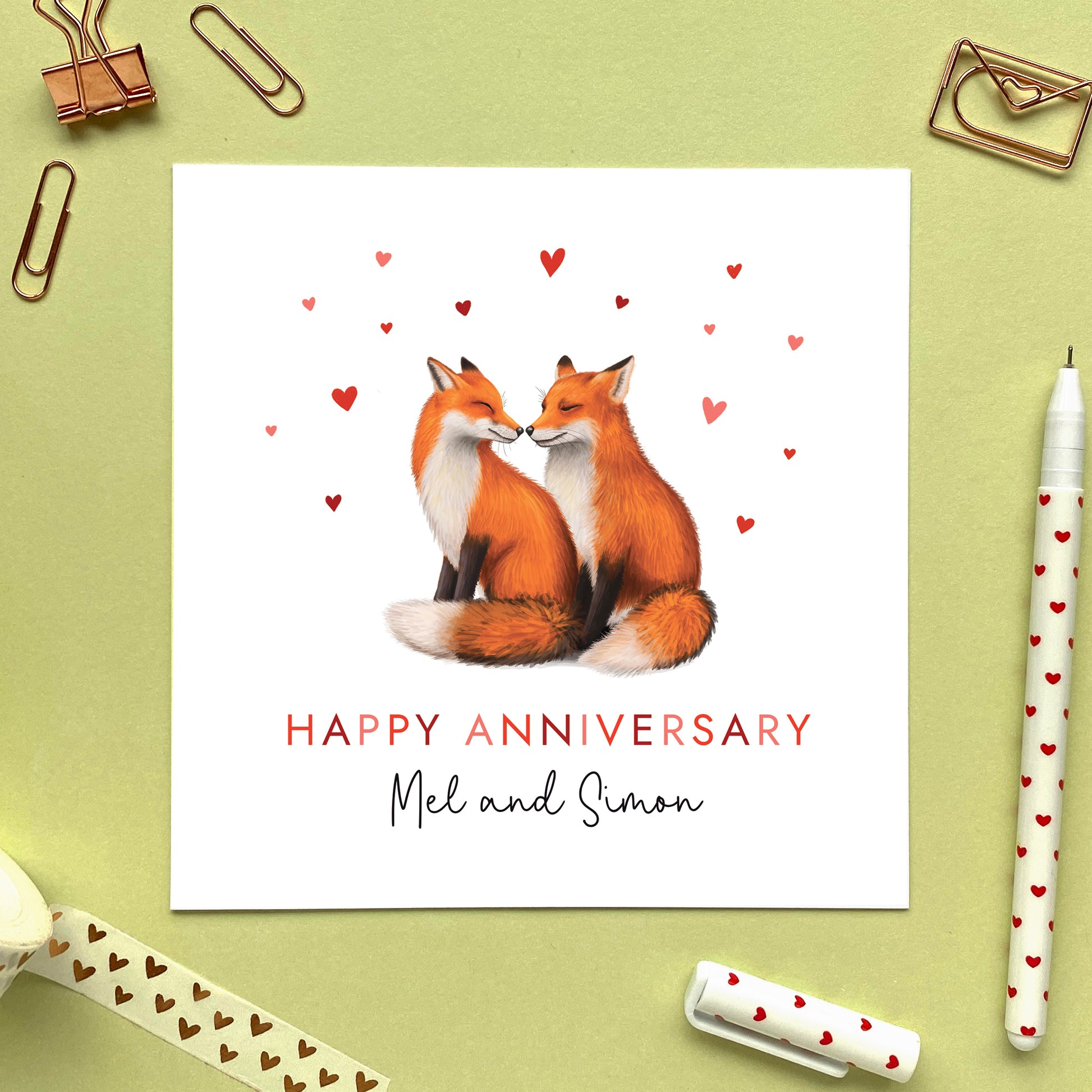 A personalised anniversary card featuring two foxes surrounded by hearts. It is suitable for any couple such as friends, family, daughter and son in law, brother and sister in law, grandson and girlfriend, granddaughter and boyfriend. It can be personalised with two names.