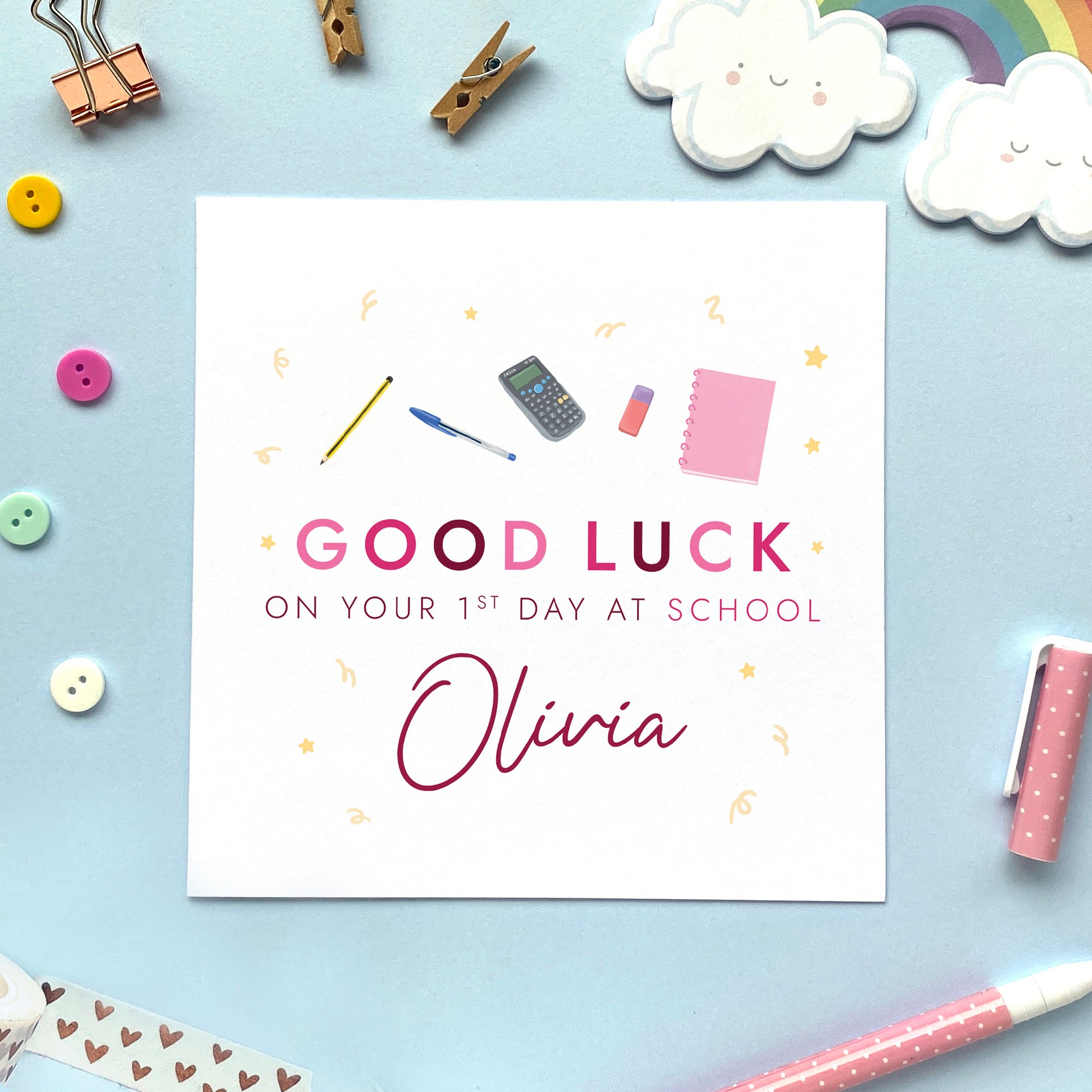 A personalised good luck on your 1st day at school card for girl, featuring good luck in pink letters and different school related stationery items. Suitable for girls starting primary school, secondary school, college and nursery. It's ideal for any female relation, such as Daughter, Granddaughter, Niece and Goddaughter. This card can be personalised with a girl's name.