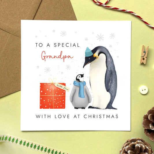 A personalsed penguins christmas card for Grandpa from one child or baby.