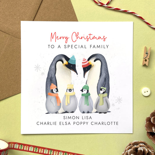 A personalised penguins Christmas Card for family with four children.