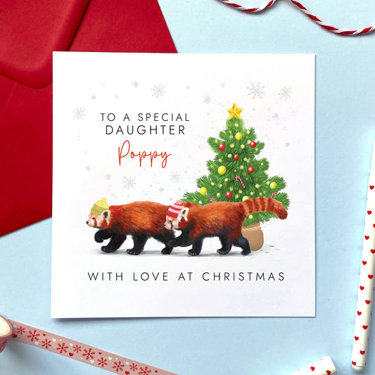 A personalised Christmas Card for Daughter featuring two red pandas and a Christmas tree.