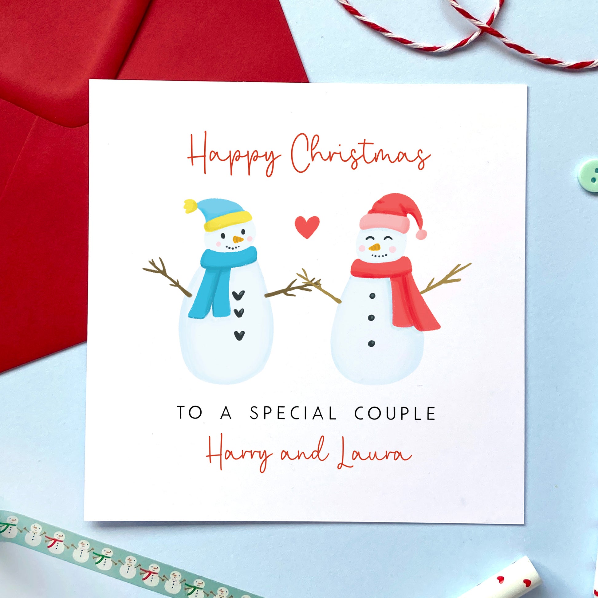 A personalised snowman Christmas card for a special couple.