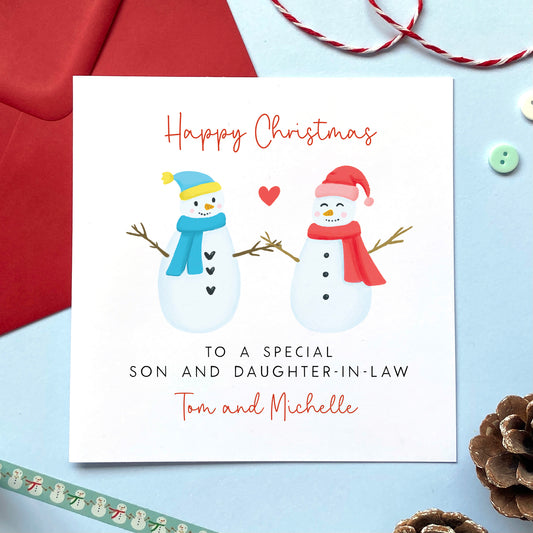 A personalised snowman couple Christmas card for Son and Daughter-in-Law.