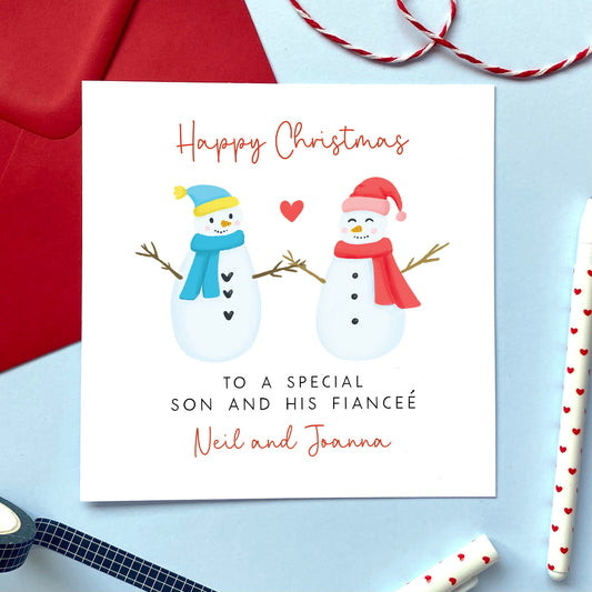 A personalised snowman couple Christmas card for Son and his Fiancée. 