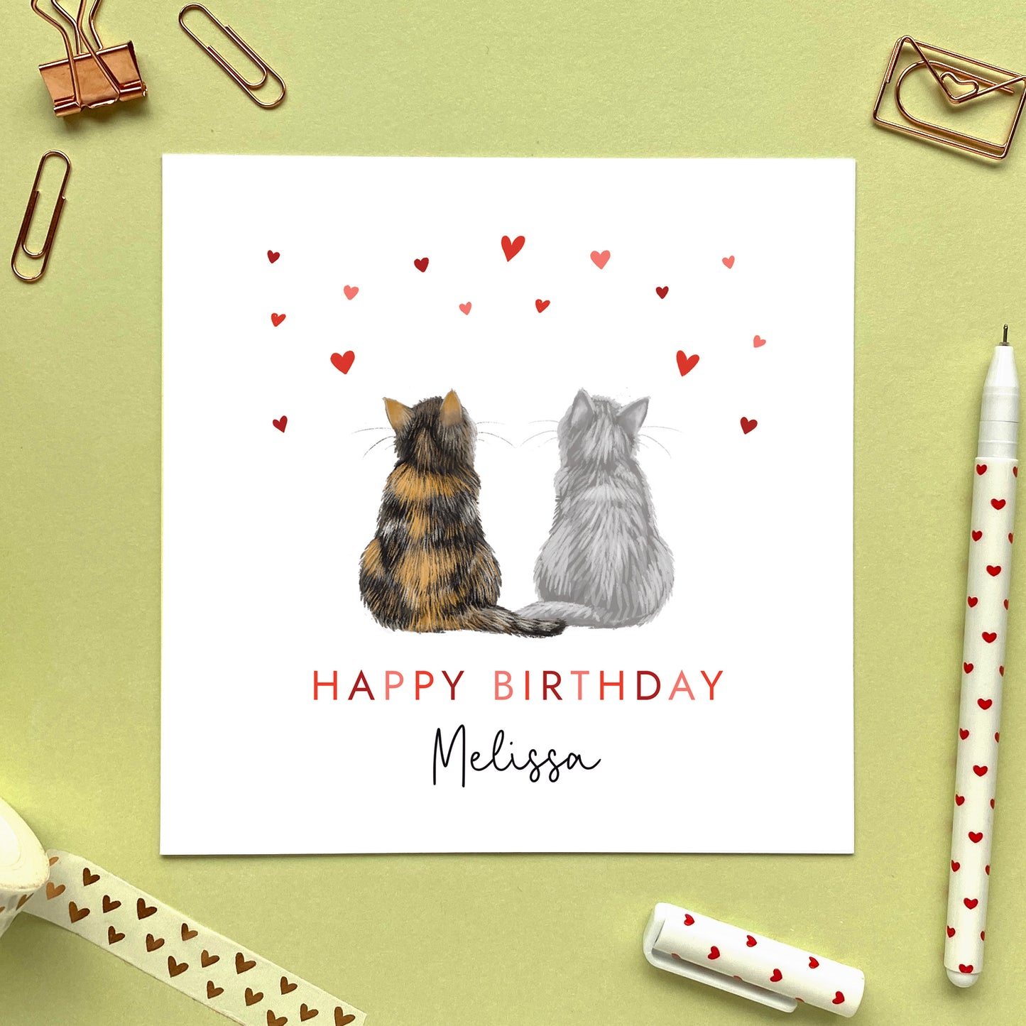 A personalised cats birthday card for partner where you can choose the two cats on the card. You can choose from a range of different cat breeds and colours, including ginger, black, tabby, ragdoll, grey and bengal cats. It can be personalised with any name. Ideal for both him and her, fiancee, fiance, husband, wife, boyfriend or girlfriend. The photo shows a calico cat and a grey cat.